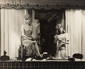 (WINDOW DISPLAYS) A group of 16 photographs of posed, fashionably dressed mannequins, some with seasonal decorations.